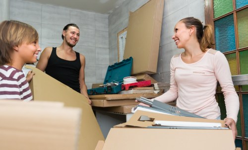 Movers preparing equipment and planning a safe relocation job