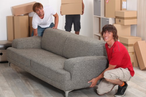 Professional movers handling furniture in a Battersea flat or townhouse