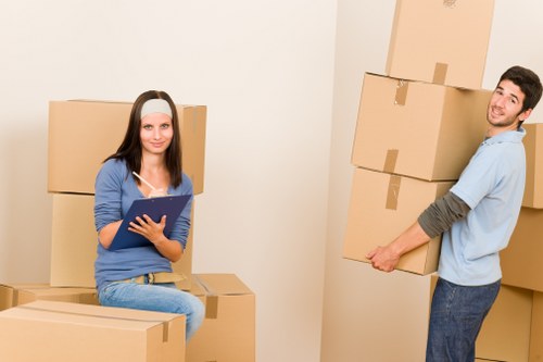 Crew separating reusable furniture for charity collection during clearance