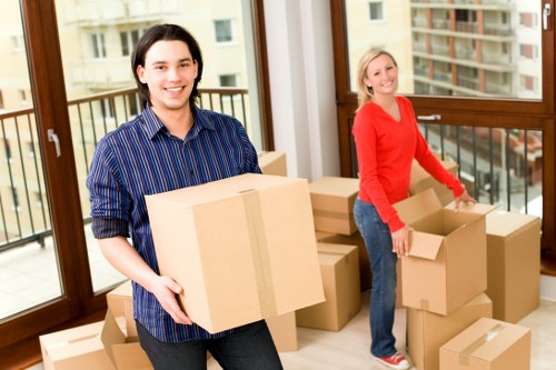 Packed office furniture and equipment ready for transport during a Battersea relocation